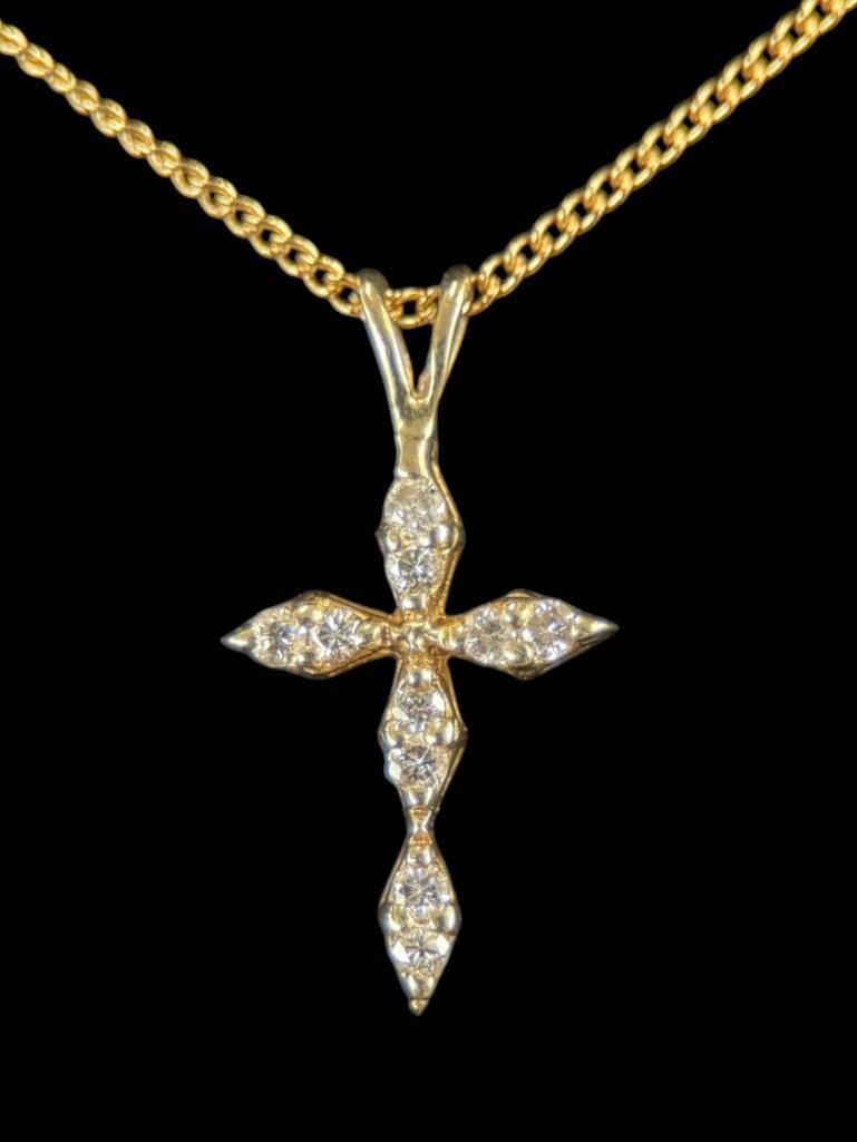 14k Gold necklace and Cross pendant: 14k Gold necklace and Cross pendant with diamonds. Total weight approx. 3 grams. Clasp to pendant approx. 8.5 inches.