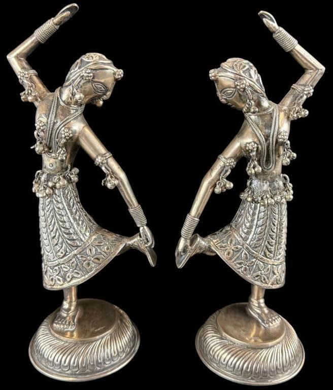 Pair of Silver Dancing Statues: Pair of Silver Dancing Statues. Marked Silver, tests as low grade. Approx. 9.5 inches tall.