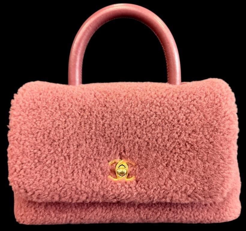 CHANEL Coco Handle bag: CHANEL Coco Handle bag in dark pink shearling wool. Serial # 23419902. Includes shoulder strap. Approx. 10 x 6 x 4 inches. Provenance: From an Italian collector.