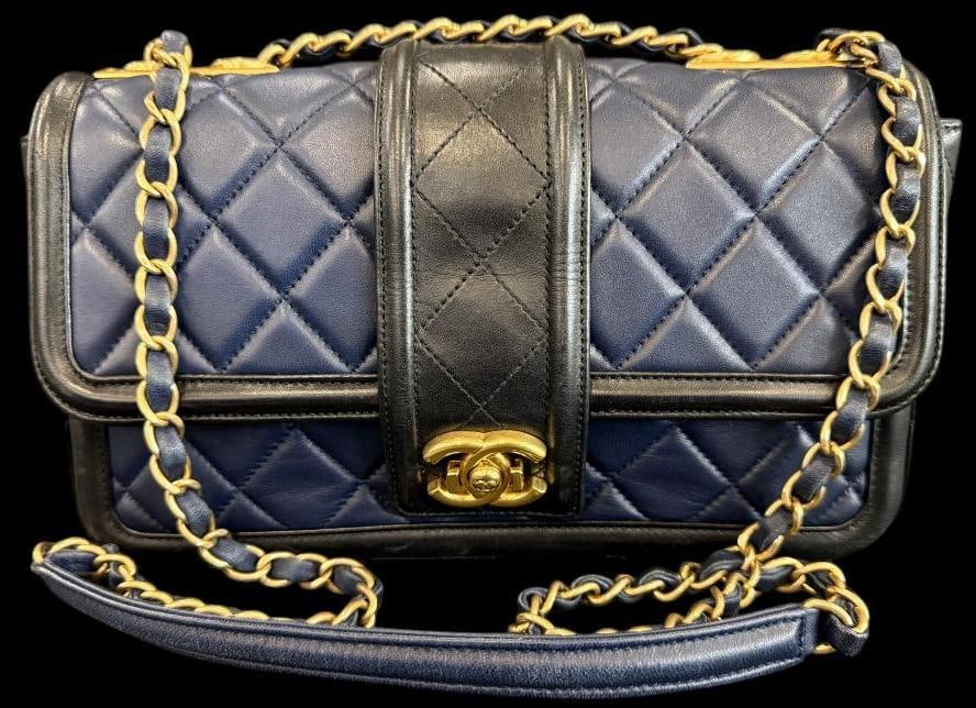 CHANEL Elegant Quilted Flap bag: CHANEL Elegant Quilted Flap bag in navy and black leather. Serial # 20756414. Approx. 11 x 6 x 3 inches. Provenance: From an Italian collector.