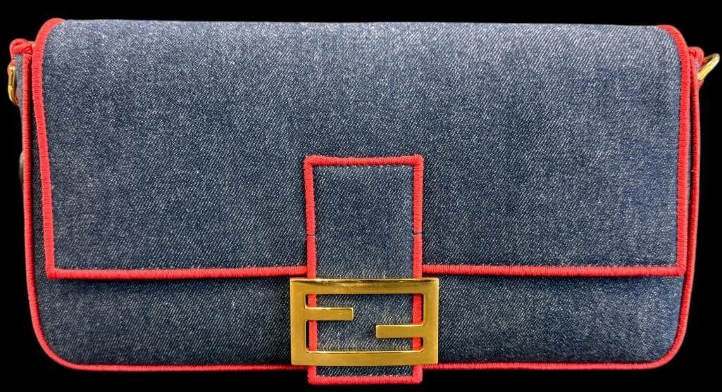 Fendi Denim Baguette bag: Fendi Denim Baguette bag. Serial # 8BR771-A6VN-1980301. Comes with original paperwork and pamphlets. Approx. 13 x 8 x 3 inches. Provenance: From an Italian collector.