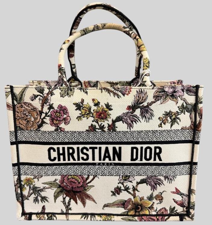 Christian Dior Canvas Jardin Botanique book tote: Christian Dior Canvas Jardin Botanique embroidered book tote. Serial # 50-MA-0282. Includes removable felt organizer and Legitmark C.O.A. Approx. 14 x 11 x 6.5 inches.Provenance: From an Italian colle