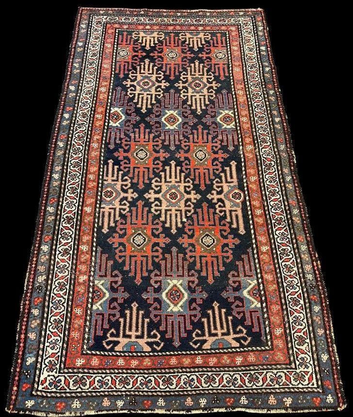 Antique Persian rug: Antique Persian rug with tribal designs. Approx. 76 x 42 inches.