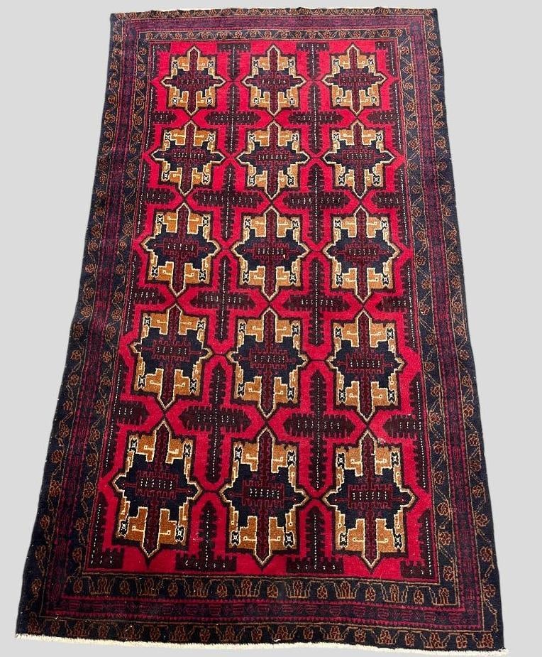 Handmade Afghanistan rug: Handmade Afghanistan rug with geometric tribal design. Approx. 82 x 46 inches.