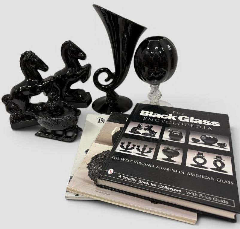 5 Pieces of Black Art Glass: 5 Pieces of Black Art Glass. Including pair of Horse Bookends by L.E. Smith, Westmoreland 2 piece Santa and Sleigh, Cambridge Cornucopia Vase, Cambridge Ivy Ball c.1930's and 3 Black Glass reference