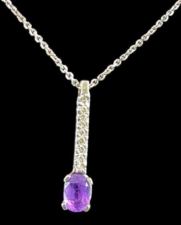 14k Gold Necklace and Pendant with Diamonds and Amethysts: 14k Gold Necklace and Pendant with Diamonds and Amethysts. Approx. 4.6 grams. Approx. 9.5 inches clasp to pendant.