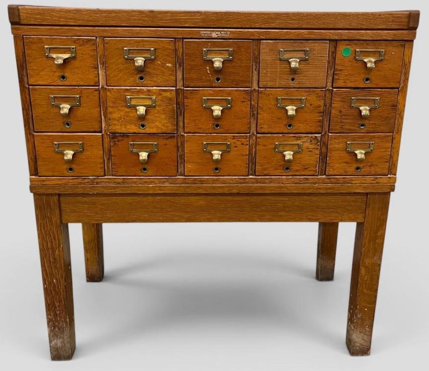 Oak Card Catalog cabinet: 15 drawer Oak Card Catalog cabinet. Approx. 34.5 x 33 x 17.5 inches.
