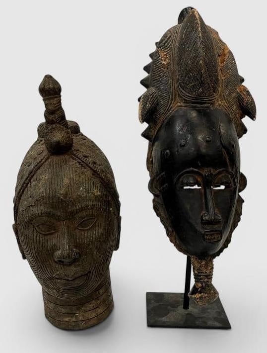 African metal head and carved portrait mask: African metal head and carved portrait mask. 2 pieces. Mask approx. 19 x 7 x 9 inches. Provenance: These pieces come from the Herbert F. Johnson Museum of Art at Cornell University NY.