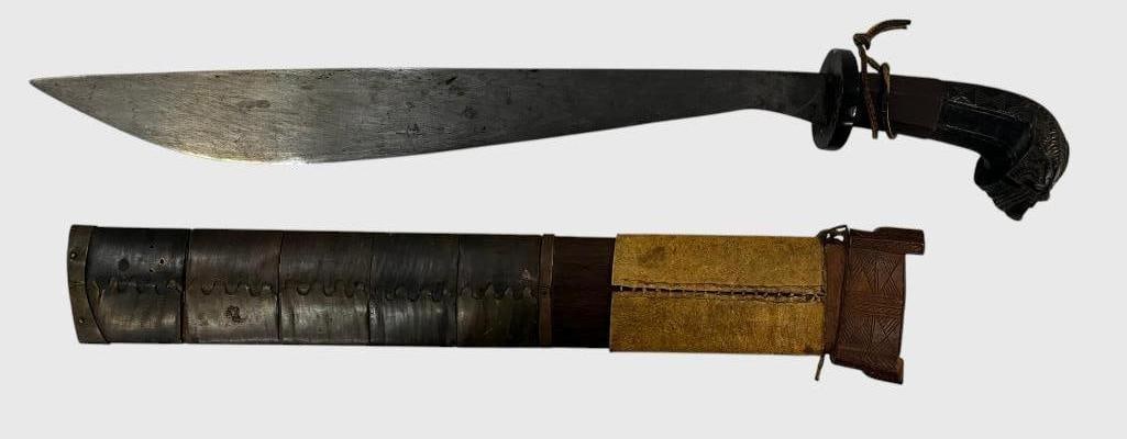 Tenegre / Binanson Sword: Tenegre / Binanson Sword from the Panay Islands. Face carved pommel. Overall length in scabbard approx. 24 inches.
