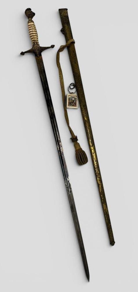 Named Militia Presentation Sword: Named Militia Presentation Sword. Presented to John M. Cyrus of Co. E 50 Ill. Inf. Blade is finely etched. Includes research. Sword in scabbard approx. 38 x 5 x 2 inches.