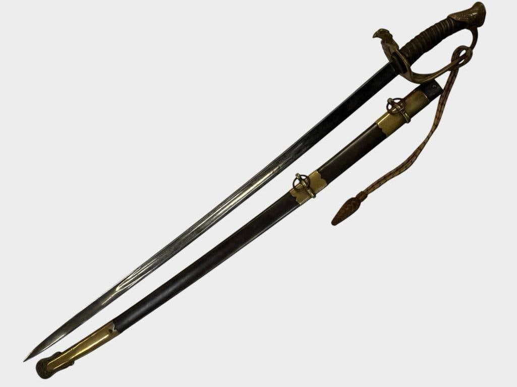 U.S. Model 1850 Sword: U.S. Model 1850 Sword. Blade is finely etched. .Sword in scabbard approx. 39 x 5 x 4 inches.