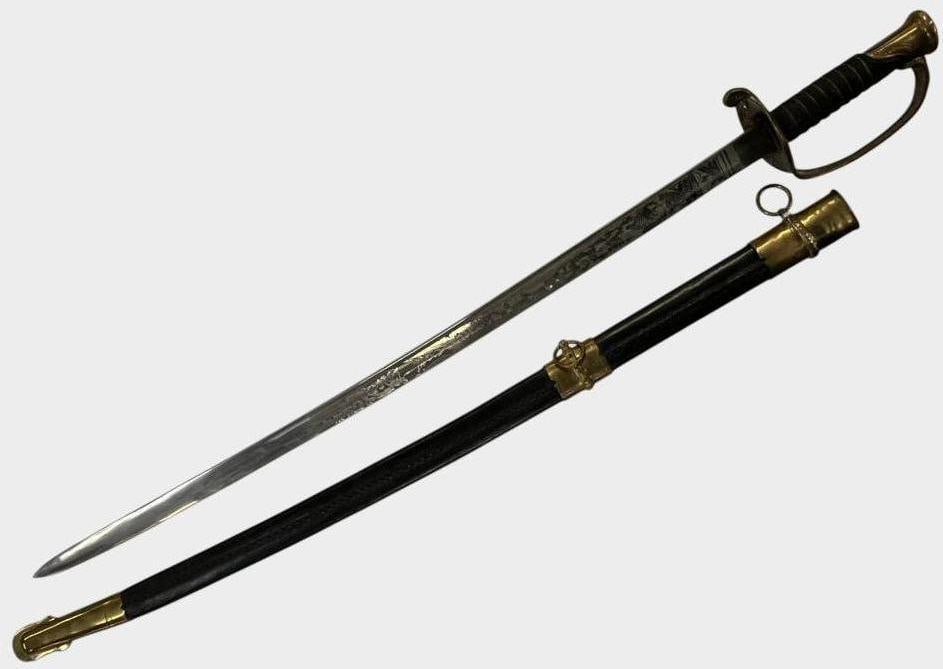 U.S. Model 1850 Sword: U.S. Model 1850 Sword. Blade is nicely etched. Sword in scabbard approx. 40 x 5 x 3 inches..