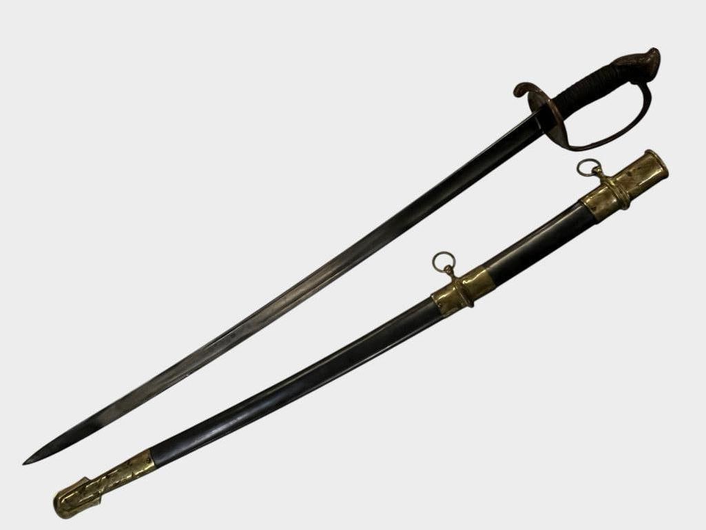 U.S. Model 1850 Sword: U.S. Model 1850 Sword. Sword in scabbard approx. 41 x 5 x 3 inches.