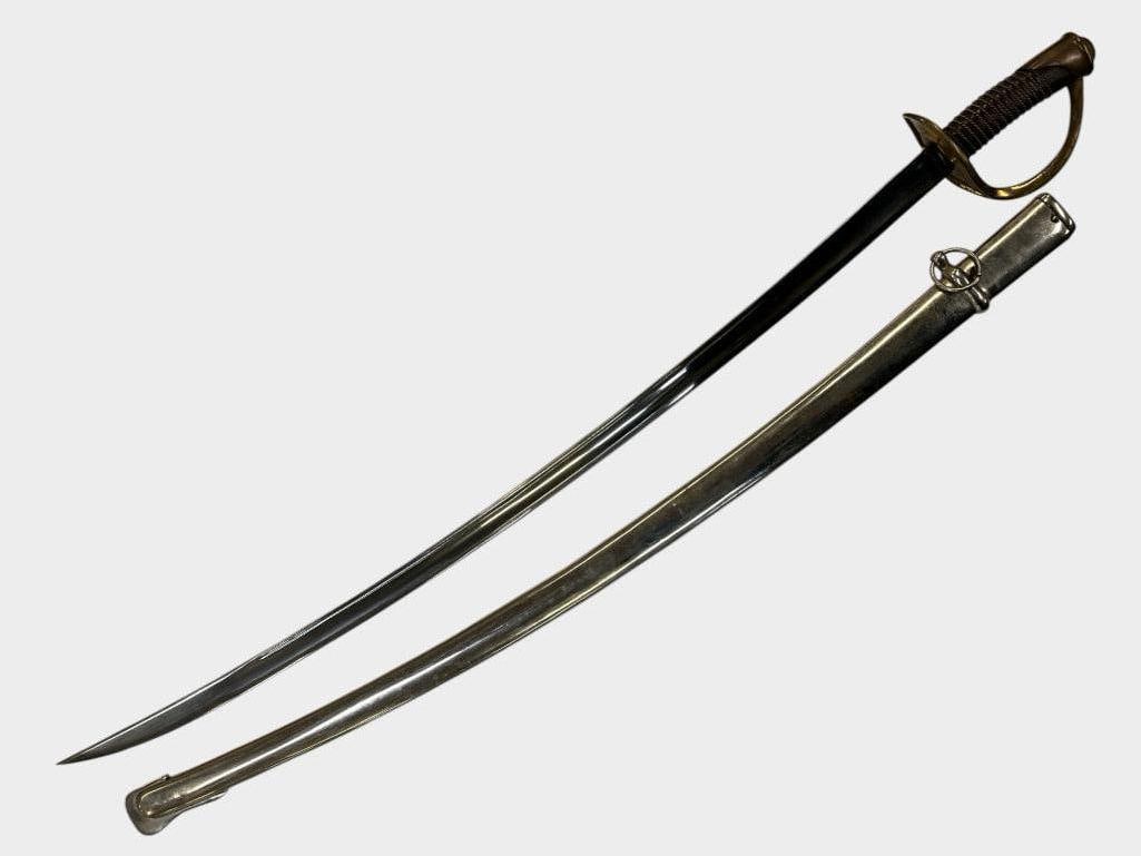 Cavalry Sabre: Cavalry Sabre. Blade is marked RVH? and 1981. Sword in scabbard is approx. 44 x 5 x 3 inches.