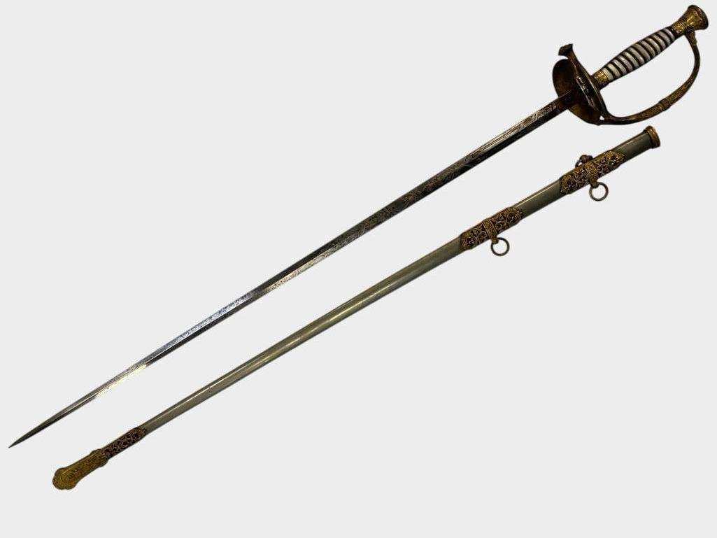 U.S. Model 1860 Sword: U.S. Model 1860 Sword with mother of pearl handle. Etched blade with gold highlights. Marked H.V. Allens Co. New York and France on the reverse. Sword in scabbard approx. 39 x 5 x 4 inches.