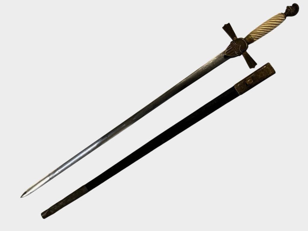 U.S. Militia Sword with Scabbard: U.S. Militia Sword with Scabbard. Knights helmet pommel. Blade is nicely etched with Onward to Victory. Sword in scabbard approx. 32 x 5 x 1.5 inches.