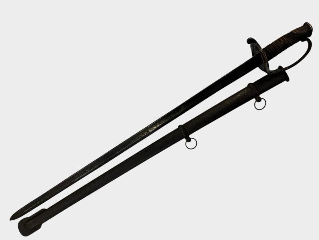 CSA marked sword: CSA marked sword. W.J. McElroy & Co. CS 1862. Blade is finely etched. Sword in scabbard approx. 37 x 5 x 4 inches.