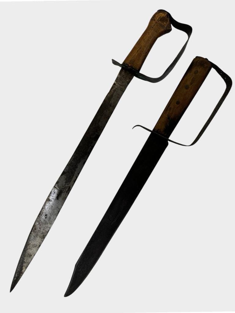 2 D Guard Knives: 2 D Guard Knives. One is marked Featherweight with a cutlass design. Largest approx. 24 x 5 x 3 inches.