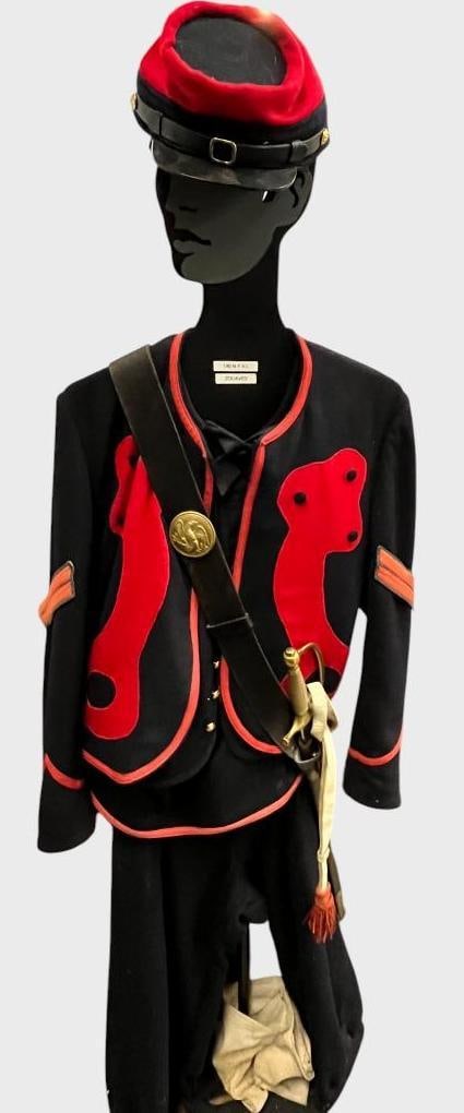 140 N.Y.V.I. Zouaves Uniform: 140 N.Y.V.I. Zouaves Uniform. Includes Kepi, Jacket, pants, sword baldric and AMES Mfg. Co. Chicopee Mass. sword. Sword marked U.S. AHC 1862. Sword approx. 34 x 5 x 1 inches.