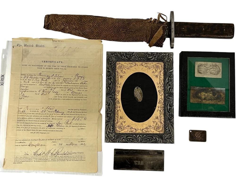 Named Knife, I.D. tags, Discharge etc.: 7 pieces. Henry W. Caldwell D Co. NY 121st Infantry oval I.D. tag, Leonard Barker K Co. VA 9th Cavalry knife if stenciled snakeskin sheath with metal stencil plate, George Goodhue G Co. NY 69th