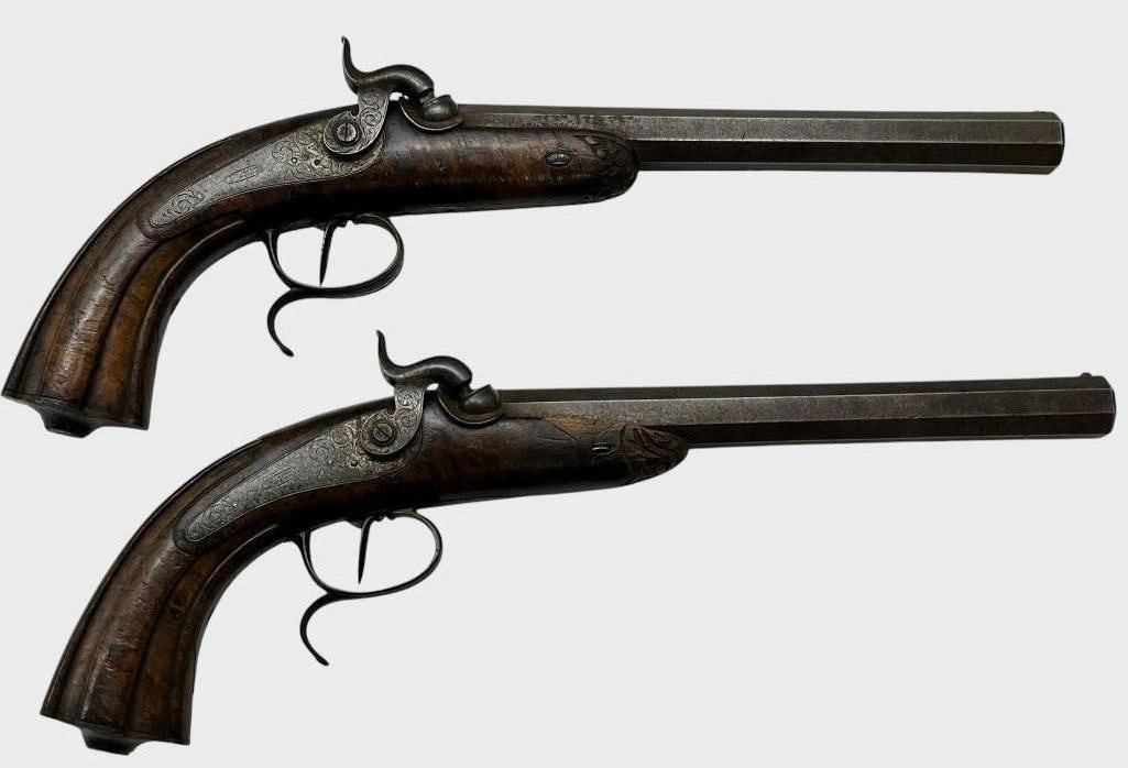 2 Percussion Dueling Pistols: 2 Dueling Percussion Pistols. Makers mark illegible. Nicely engraved. Overall approx. 16 inches.