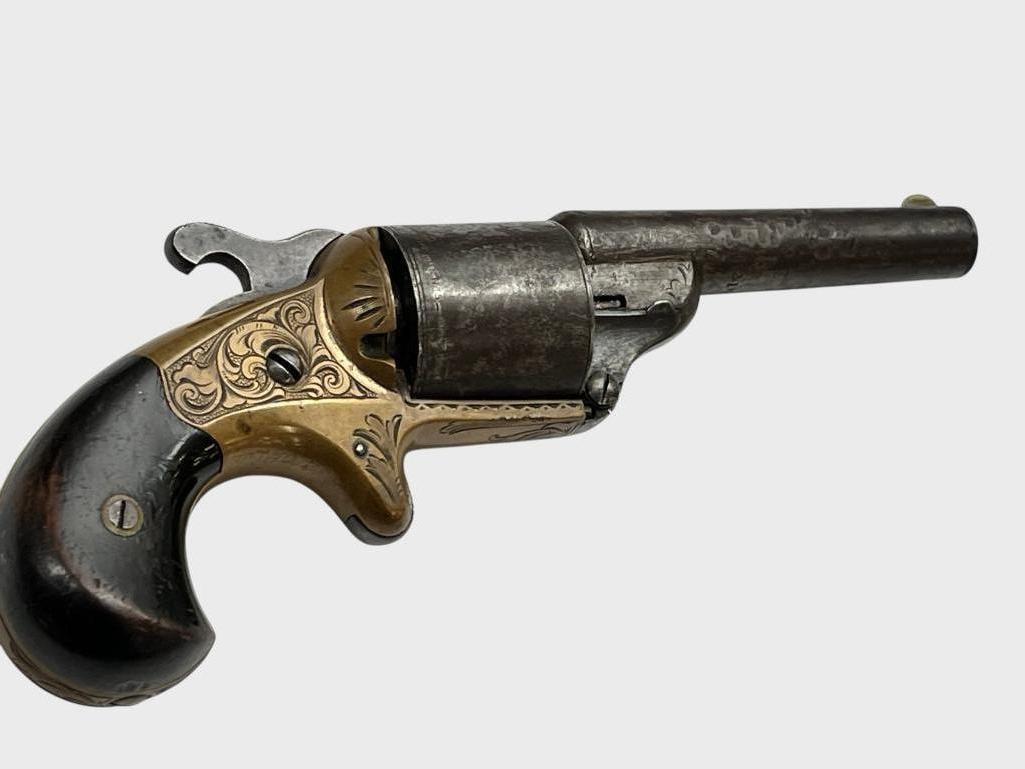 Antique Moore Teat Fire revolver: Antique Moore Teat Fire revolver. Nicely engraved. Serial # 21435. Barrel length approx. 3.25 inches.
