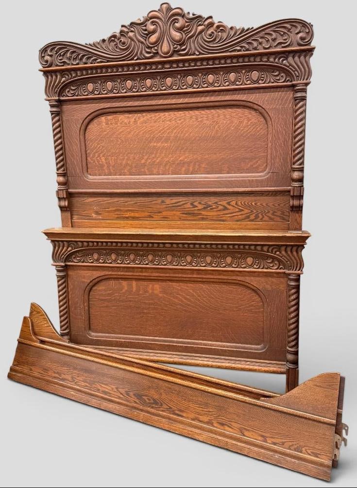 Nicely Carved Oak Bed: Nicely Carved Oak Bed. Includes headboard, footboard and side rails. Headboard approx. 82 x 57 inches.