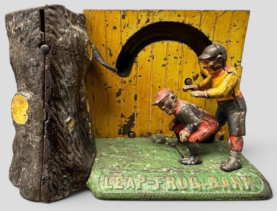 Leapfrog Mechanical Bank: Antique Leapfrog Mechanical Bank. Approx. 7.5 x 5 x 3.5 inches.