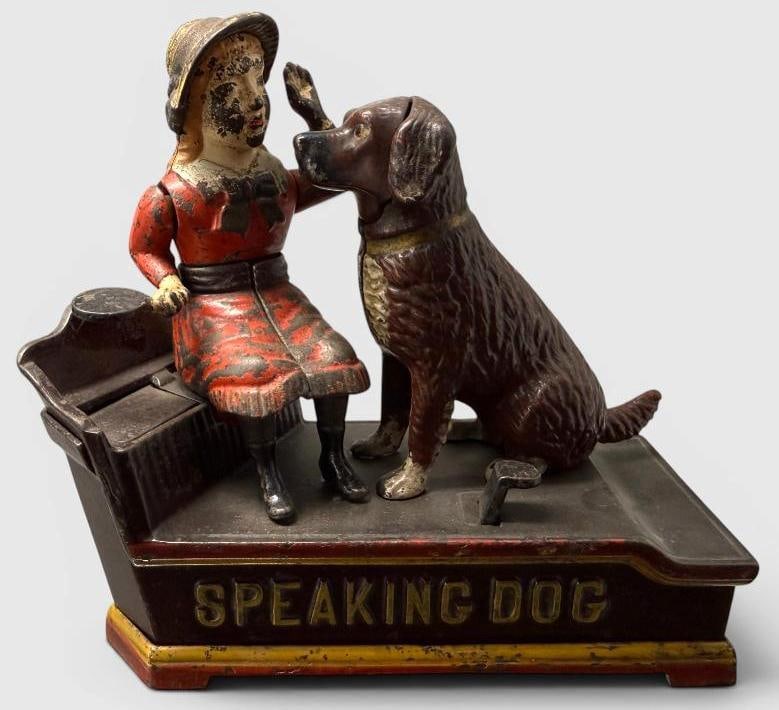 Speaking Dog Mechanical Bank: Antique Speaking Dog Mechanical Bank. Approx. 7.5 x 7.5 x 3.5 inches.