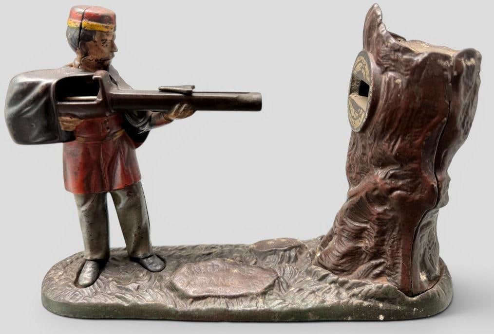 Creedmoor Mechanical Bank: Antique Creedmoor Mechanical Bank. Approx. 10 x 7 x 2.5 inches.
