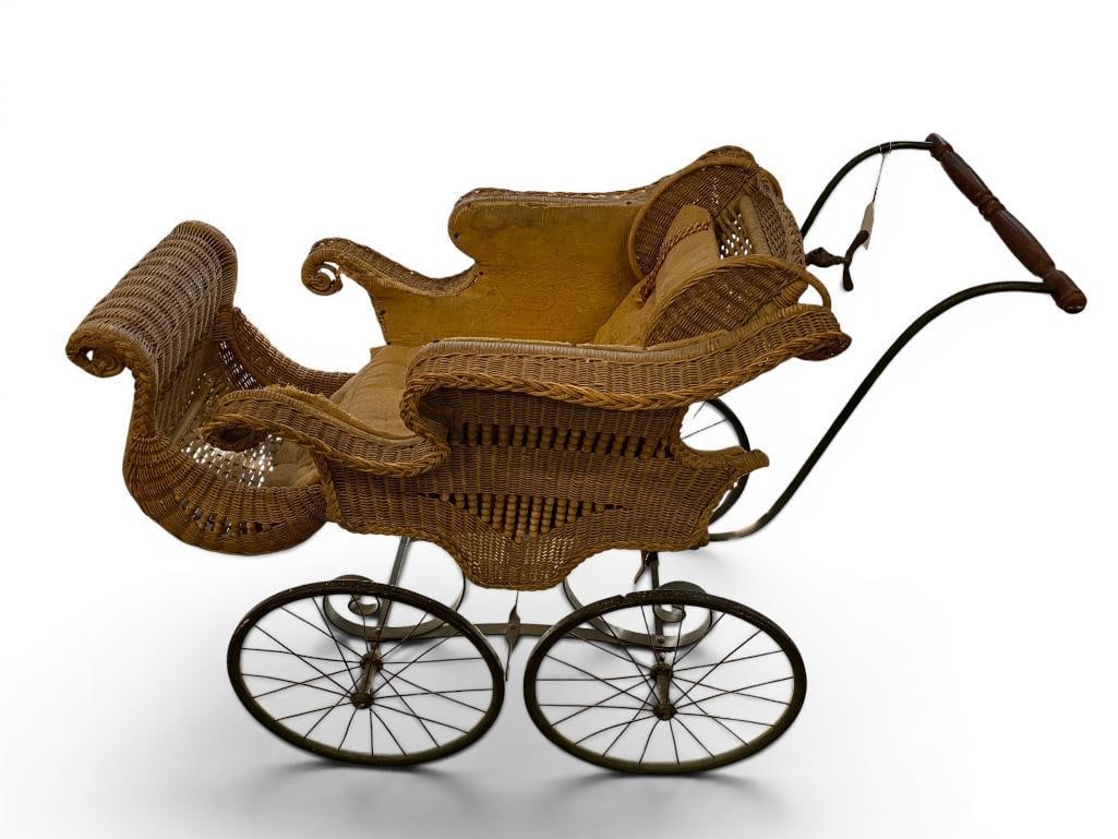 Antique Wicker Buggy: Antique Wicker Buggy. Approx. 45 x 34 x 22 inches.