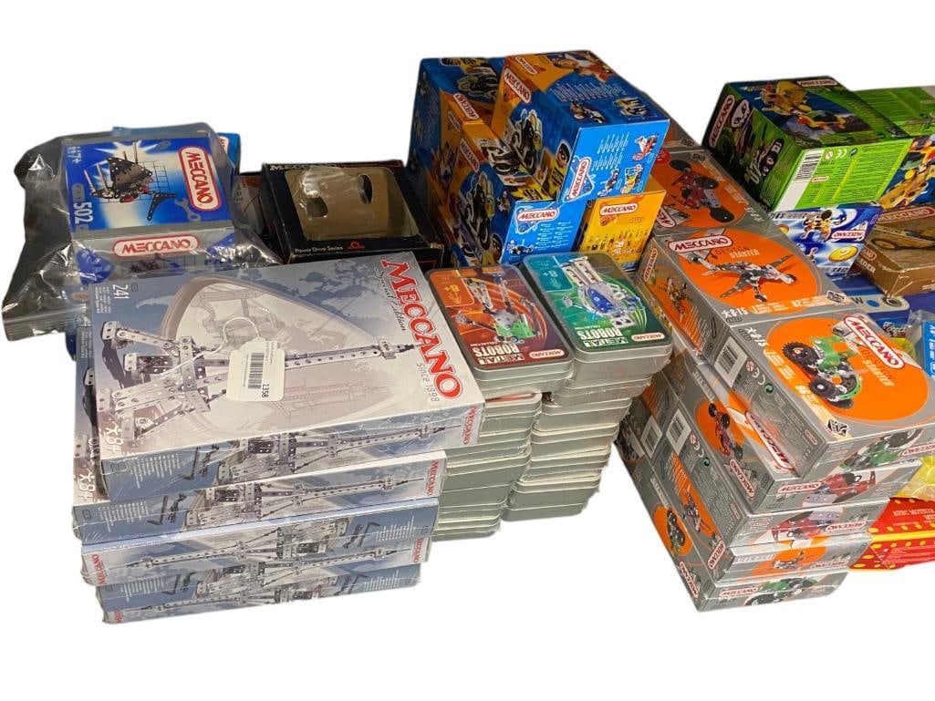 Group of Meccano Toys: Group of Meccano Toys. Most are new in box. Including metal robots, Eiffel Tower and more. Approx. 59 pieces.