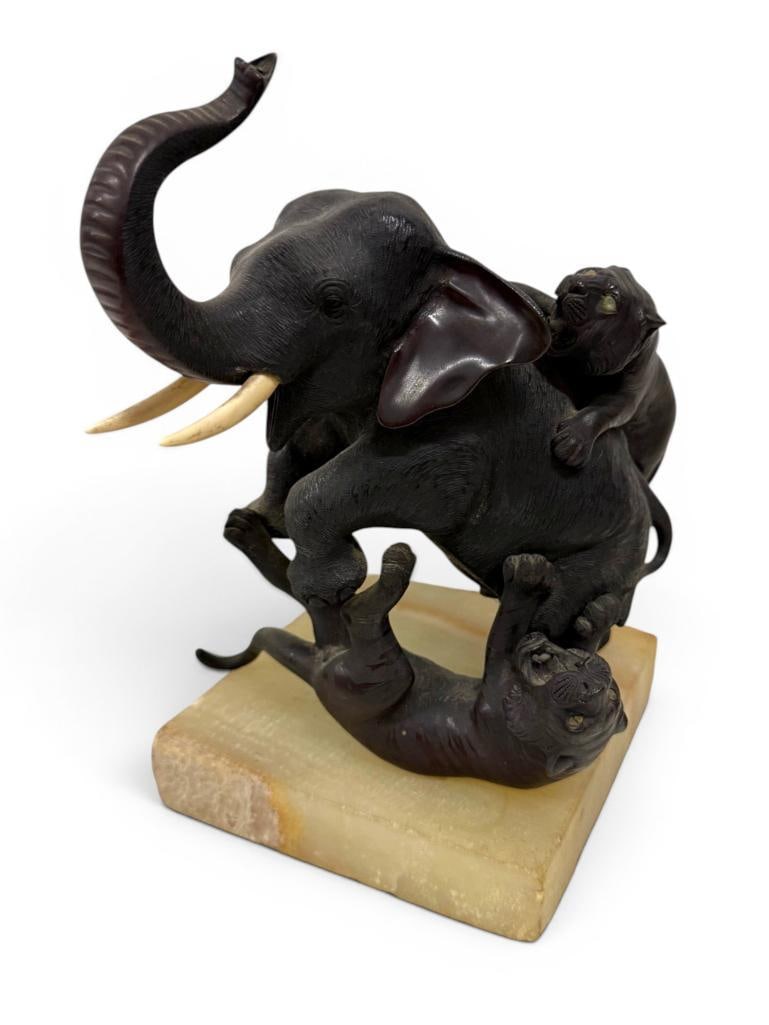 Meiji Bronze Sculpture of an Elephant: Signed Meiji Bronze Sculpture of an Elephant Attacked by Tigers. Approx. 9 x 7 x 5 inches.