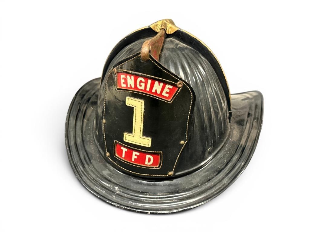Cairns & Brother Metal Fire Helmet: Cairns & Brother Metal Fire Helmet. Leather Tonawanda Fire Shield on front. Approx. 15 x 12 x 7 inches.