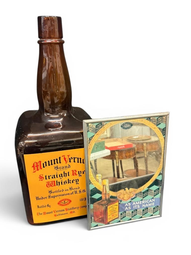 Mount Vernon Advertising Mirror and Display Bottle: Mount Vernon Rye Whiskey Advertising Mirror and Display Bottle. 2 pieces. Mirror approx. 14 x 10 inches. Bottle approx. 24 x 10 x 10 inches.