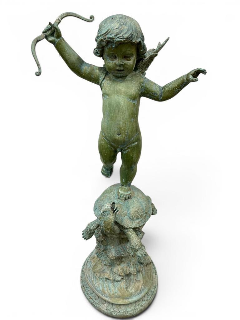Bronze Cherub Riding a Turtle Statue: Bronze Cherub Riding a Turtle Statue / water fountain. Approx. 36 x 16 x 13 inches.