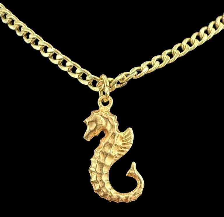14k Gold Chain with 18k Gold Seahorse Pendant: 14k Gold Chain with 18k Gold Seahorse Pendant. Total weight Approx. 7.9 grams. Clasp to pendant approx. 11 inches.