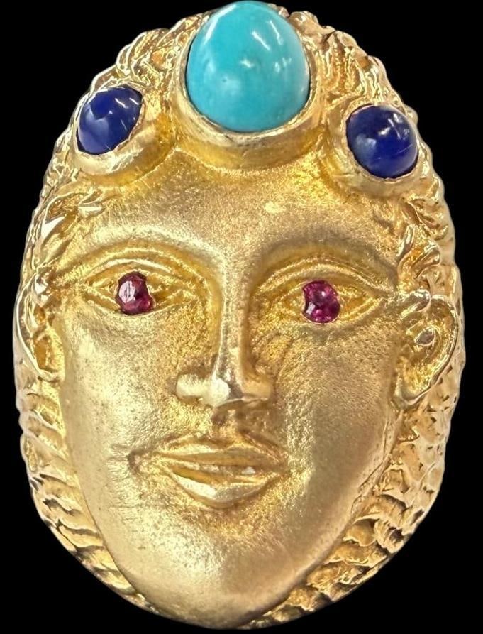 14k Gold Face Ring: 14k Gold Face Ring with turquoise, lapis and ruby stones. Approx. 10.1 grams. Approx. size 6.