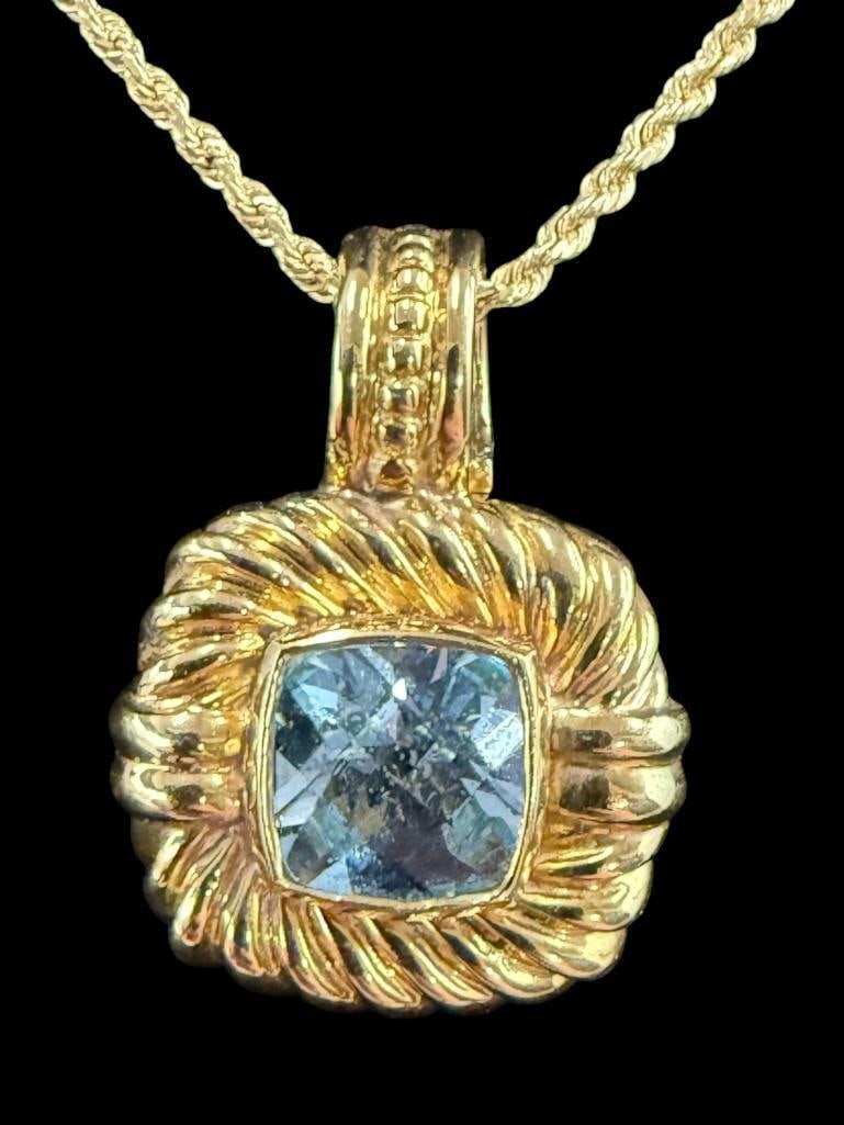 18k Gold Pendant with 14k Gold Chain: 18k Gold David Yurman Pendant with blue topaz, on a 14k Gold Chain. Pendant approx. 10.9 grams. Chain approx. 4.5 grams.