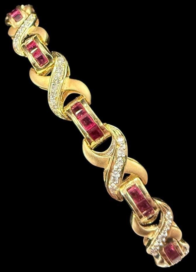 18k Gold Bracelet with Red Stones: 18k Gold Bracelet with diamonds and Red Stones. Approx. 17.7 grams. Approx. 6.75 inches.