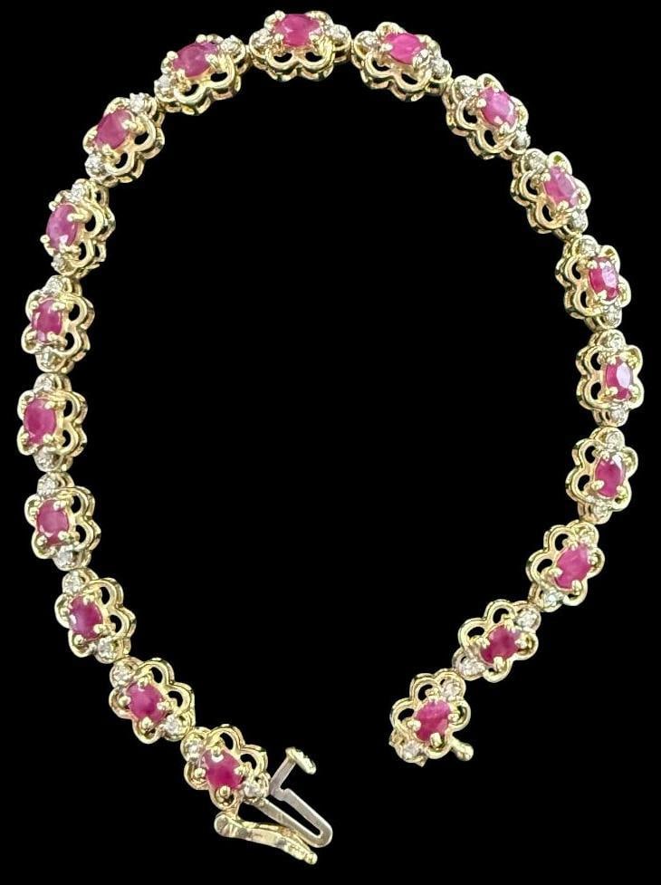 14k Gold Bracelet with Red Stones: 14k Gold Bracelet with Red Stones. Approx. 10 grams. Approx. 7 inches.