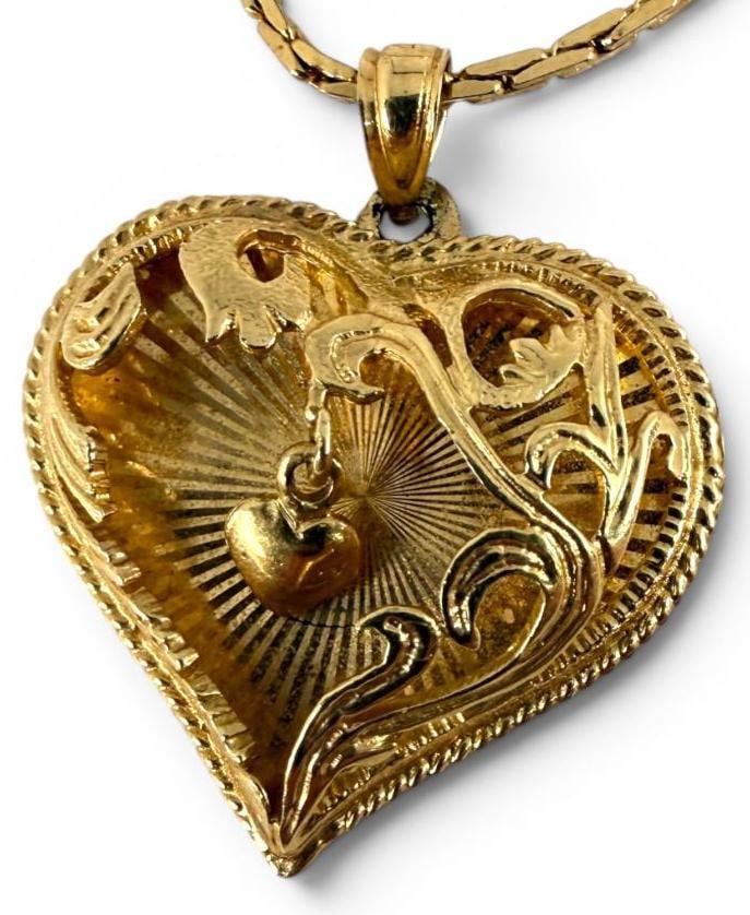 14k Gold Heart Pendant with chain: 14k Gold Heart Pendant approx. 4.1 grams. Chain is not gold. Pendant approx. 1 x 1 inches.