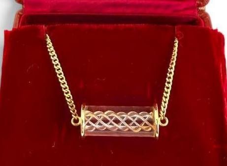 Steuben Glass Air Twist Necklace set in 14k: Steuben Glass Air Twist Necklace set in 14k Gold. Designed by Bernard X. Wolff. Clasp to pendant approx. 6 inches. Pendant approx. 1 1/8 inches.
