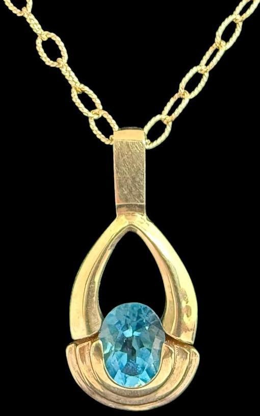 14k Gold Necklace with Blue Topaz Pendant: 14k Gold Necklace with Blue Topaz Pendant. Approx. 6.3 grams. Clasp to pendant approx. 8.5 inches.