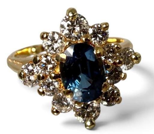 14k Gold ring with Sapphire and Diamonds: 14k Gold ring with Sapphire and Diamonds. Sapphire approx 1 ct. Approx. 4 grams. Size approx. 4.75.