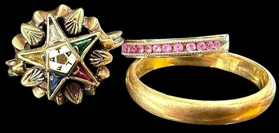 3 10k Gold Rings: 3 10k Gold Rings. Approx. 7.6 grams. One band has pink stones. One ring has the Order of the Eastern Star.