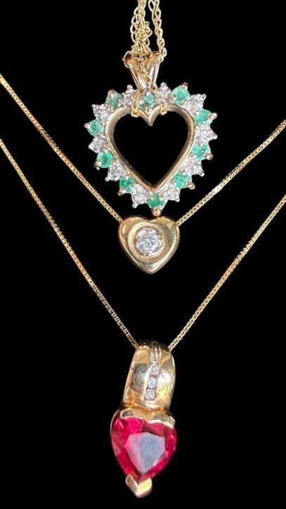 3 10k Gold Necklaces with pendants: 3 10k Gold Necklaces with pendants. Approx. 7.4 grams.