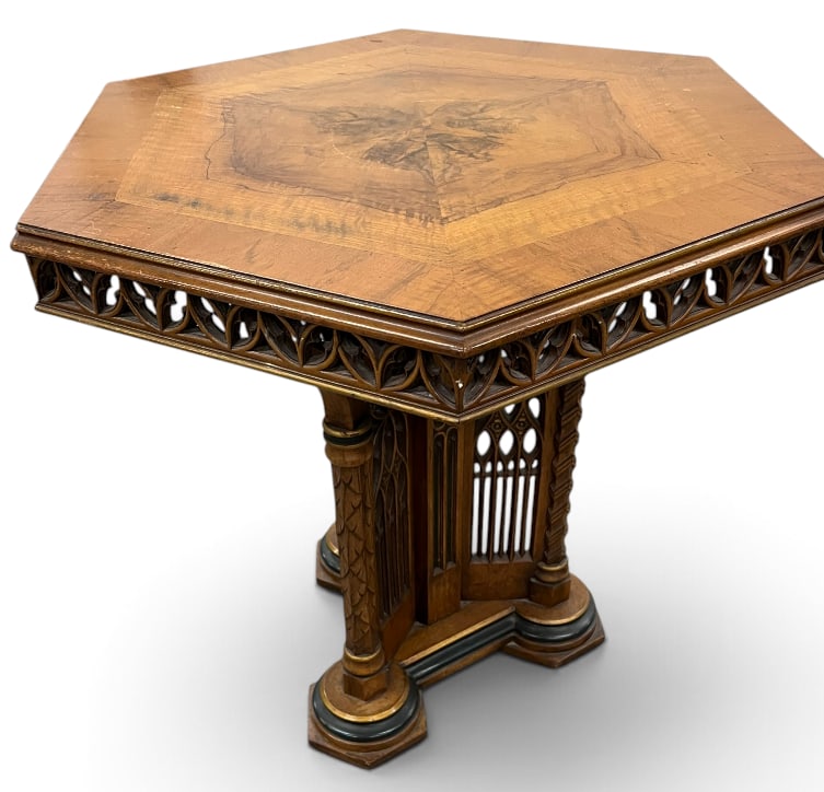 Victorian Gothic Walnut Table: Victorian Gothic Walnut Table with hexagon top. Gothic architectural style supports and reticulated fretwork. Approx. 29 x 28 x 28 inches.