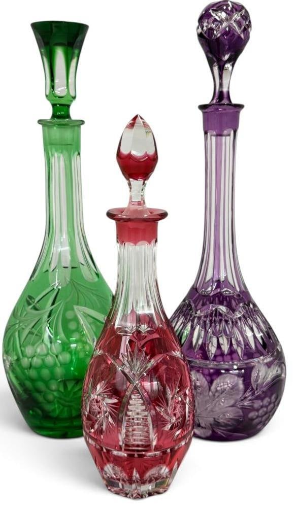 3 Cut to Clear Decanters: 3 Cut to Clear Decanters. Purple approx. 16 inches. Green approx. 15 inches. Red approx. 12 inches.
