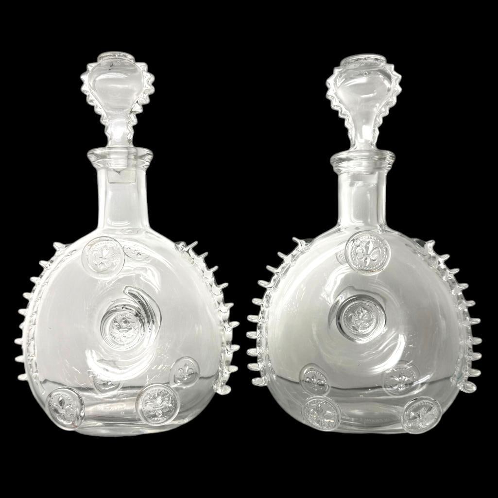 2 Remy Martin Cognac Bottles: 2 Remy Martin Cognac Bottles. One marked Baccarat Crystal. Approx. 11 x 7 x 3.5 inches.